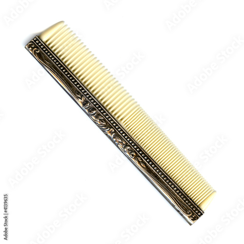 antique comb on a white background