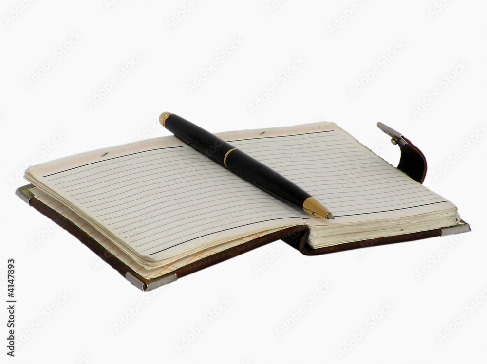 old revealled note pad with a pen old revealled note pad with a pen