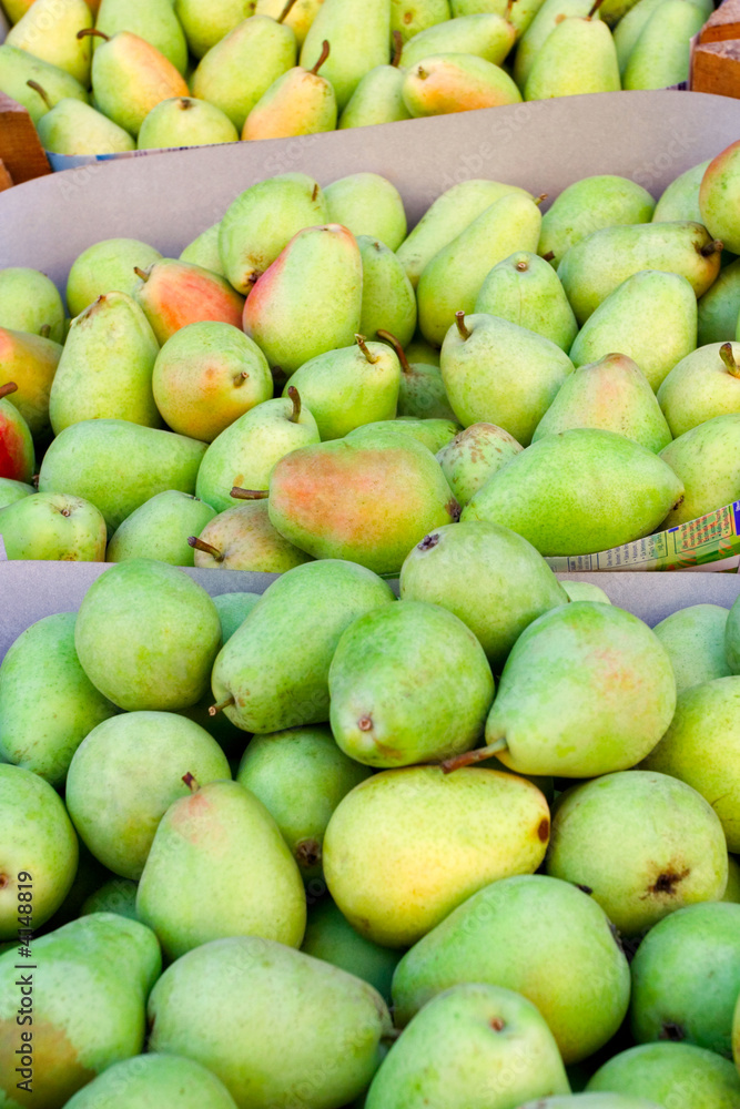 Green delicious pears at the market place