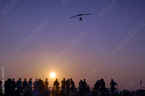people watching sunset