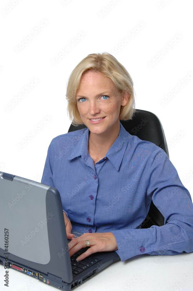 Businesswoman at her desk an computer Businesswoman at her desk an computer