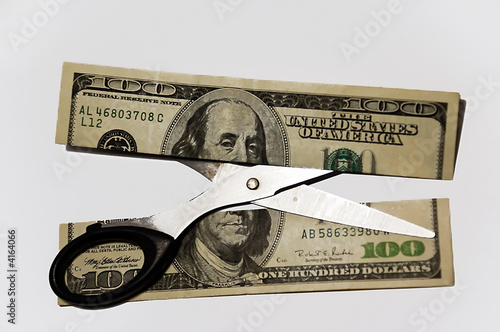 100 dollar cut with scissors 