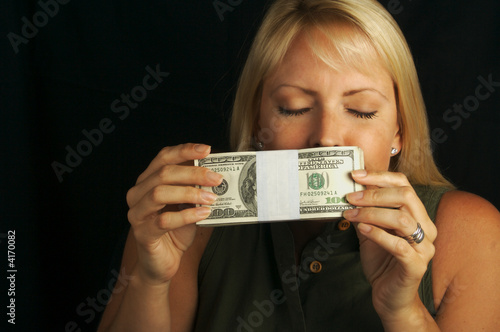 Ecstatic Woman Smells Her Stack of Cash.