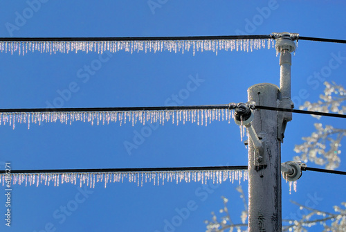 Icicles hanging from power lines after an ice storm