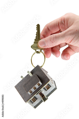 Hand holding house keys on key ring