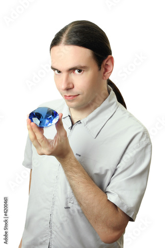 man holding a crystal