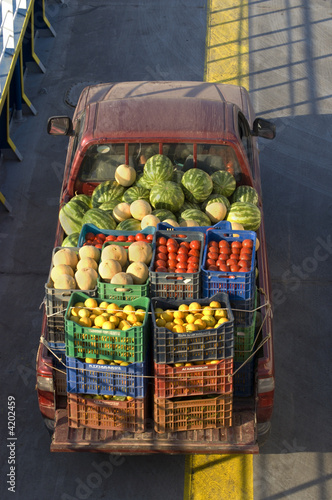 View over truck transporting fruits and vegetables with boxes