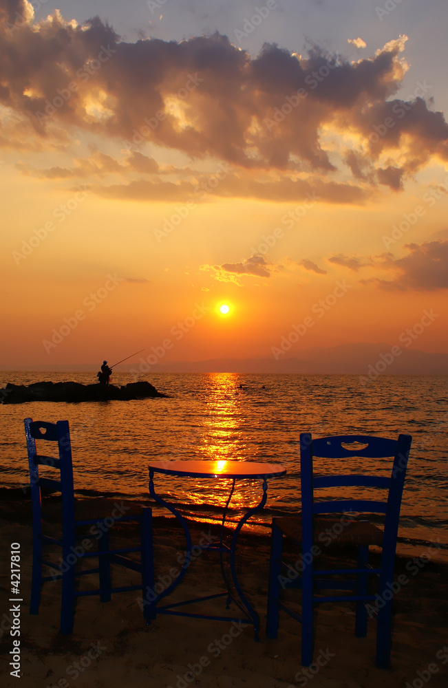 Table and two chairs at the beach