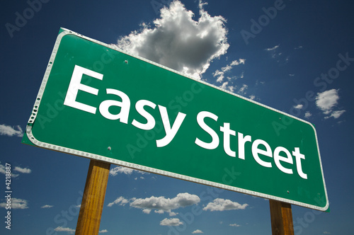 Easy Street Road Sign with dramatic clouds and sky.