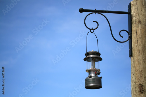 Hanging lantern against deep blue sky