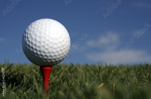 Golf Ball and Red Tee