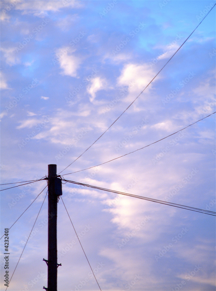 Telegraph Pole and wires against pastel sky and clouds Telegraph Pole and wires against pastel sky and clouds