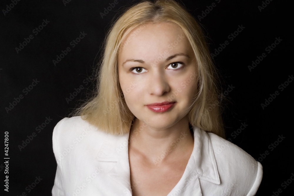 Smiling businesswoman in white on black Smiling businesswoman in white on black