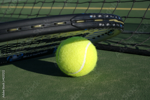 Tennis Ball & Recket on Tennis Court © JJAVA