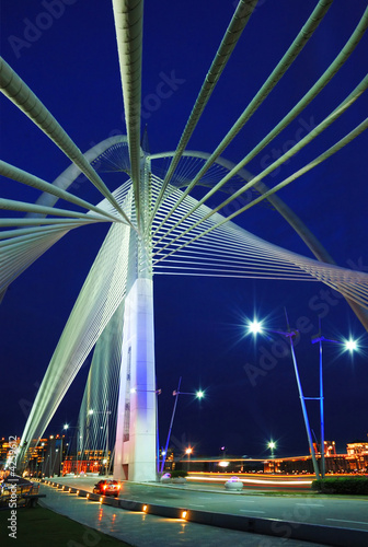 hanging bridge in evening with dark blue sky