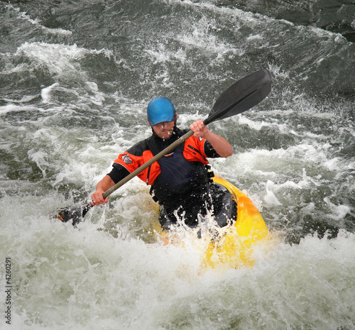 Man Kayaking on Whitewater rapids
