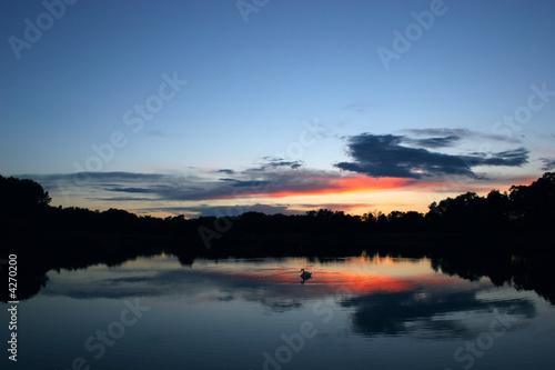 Calm lake at sunset.