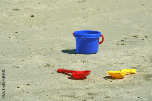 Shovels and pail on the beach