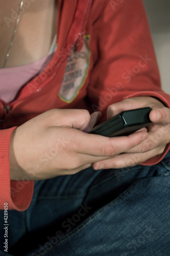 girl typing a sms message