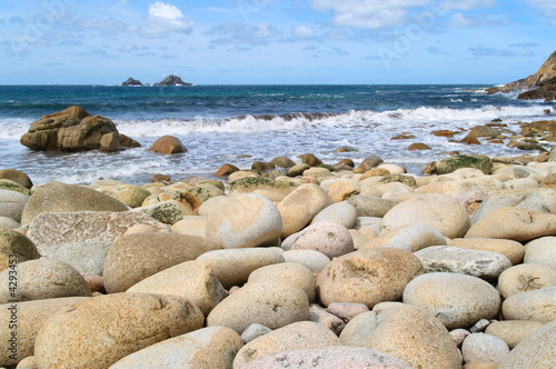 Large round stones on Porth Nanven beach, Cornwall, UK.