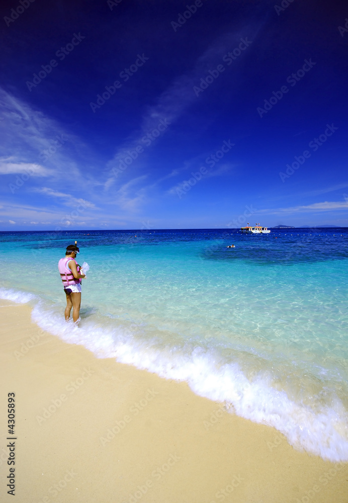 Man standing by the beach