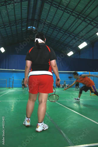 badminton  doubles match with male and female partners