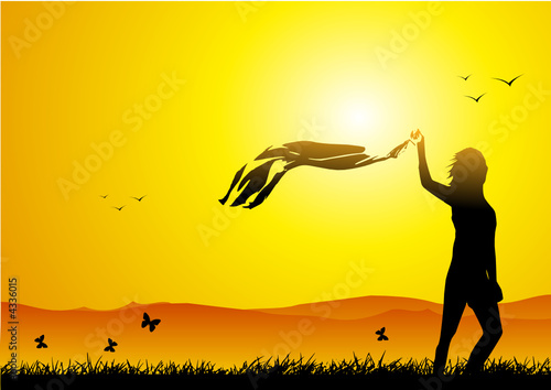 Girl walking in the wind at sunset