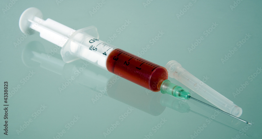 Syringe on table Syringe on table