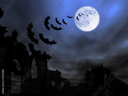 Halloween theme: bats flying over the old ruin against the Moon