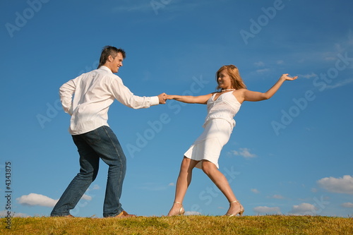 couple dancing on the meadow