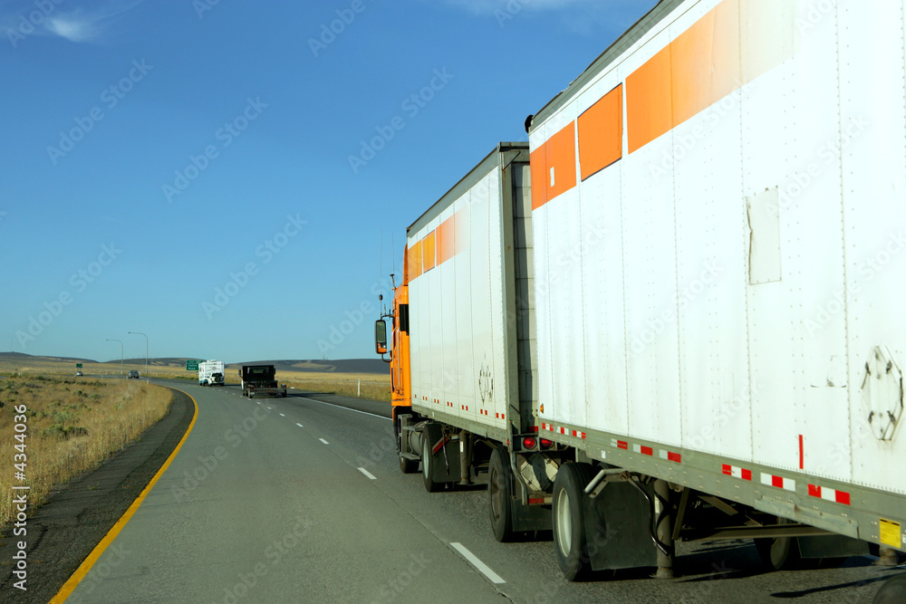 Semi truck going fast on interstate highway Semi truck going fast on interstate highway