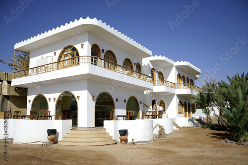 white hotel on the sea front in dahab, red sea, sinai, egypt