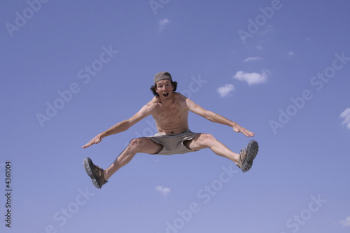 healthy happy man jumping in joy of life