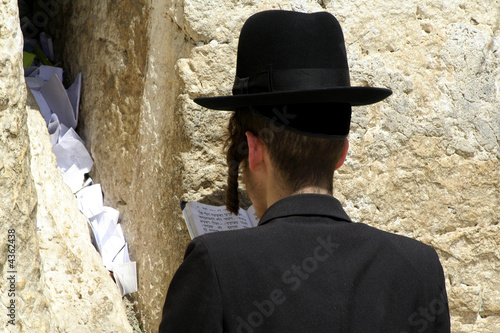Hasidic jews at the wailing western wall, jerusalem, israel photo
