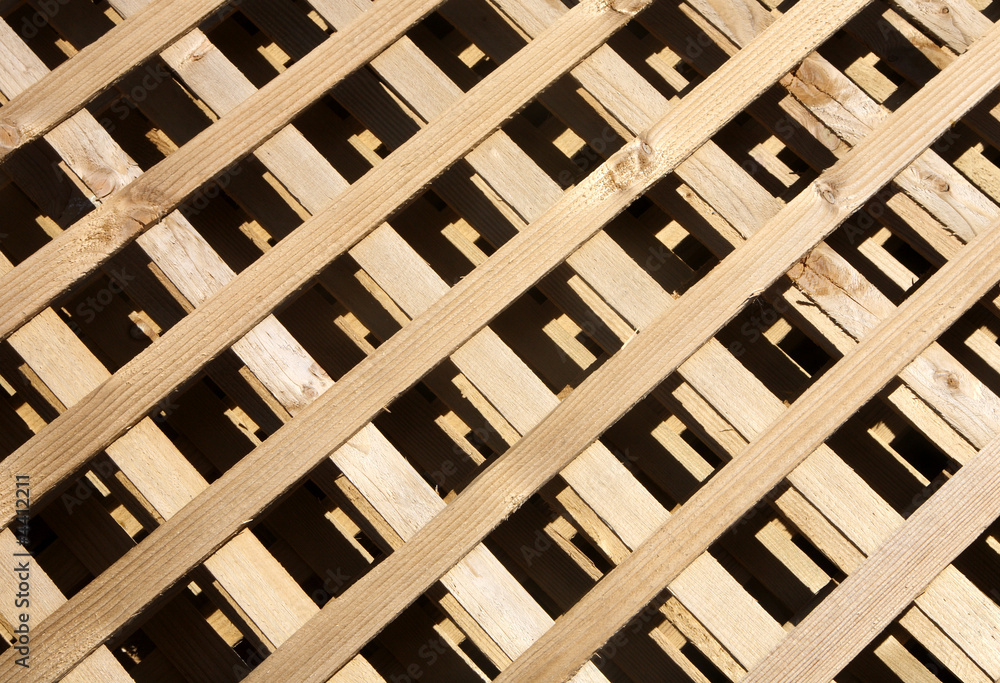 A pile of wooden garden fencing ready to construct. A pile of wooden garden fencing ready to construct.