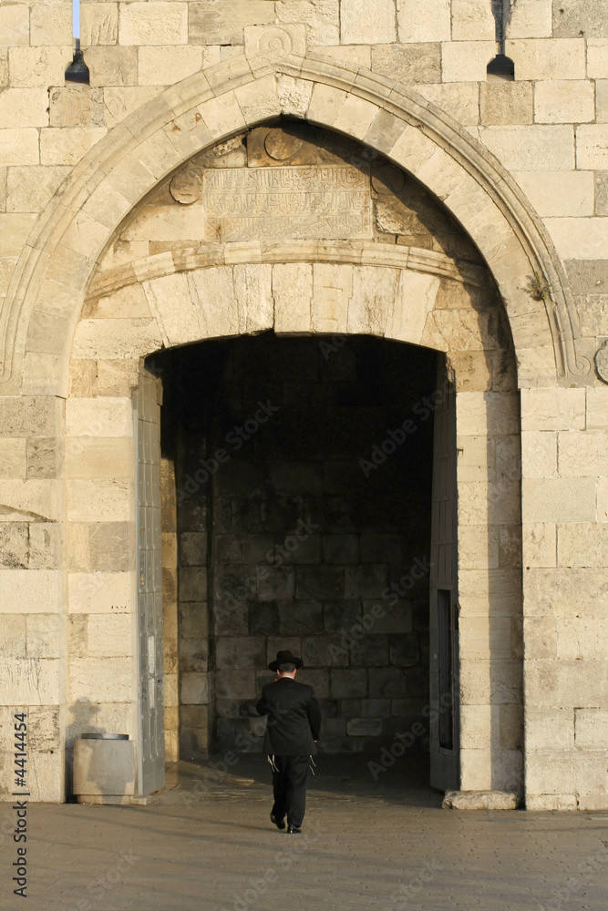 orthodox jew entering jerusalem old city , jaffa gate