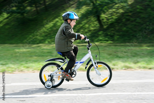 boy riding bike in a helmet