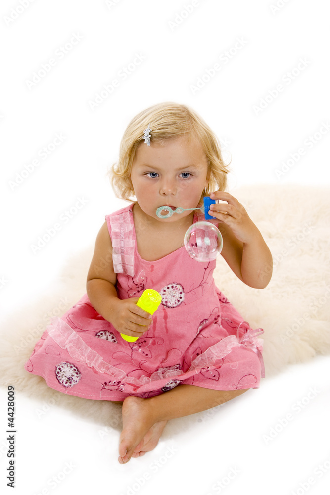 small cute girl blowing bubbles small cute girl blowing bubbles