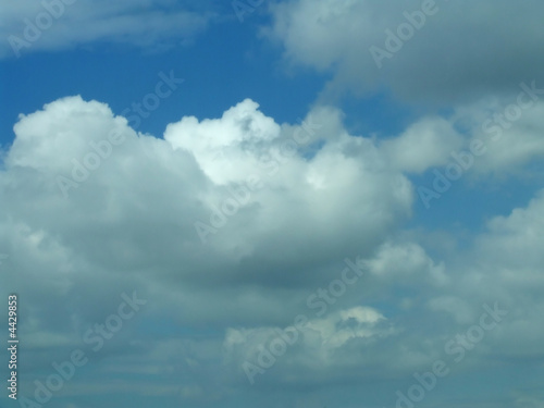 Blue bright sky with many white clouds