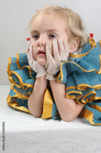 retro thinking toddler girl with gloves photo