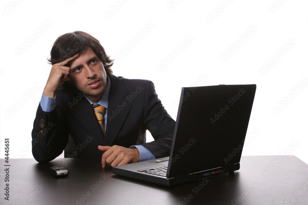 young man wondering and working with is laptop young man wondering and working with is laptop