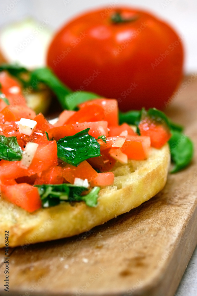 Warm toasted bruschetta with topping of fresh tomatoes, Warm toasted bruschetta with topping of fresh tomatoes,