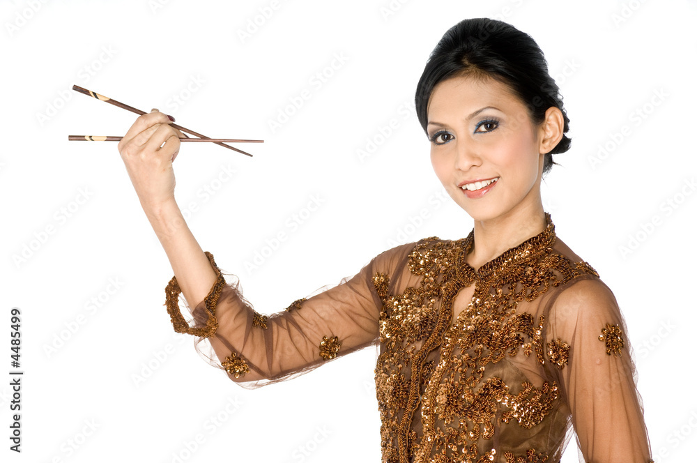 Obraz premium Beautiful asian girl playing with chopsticks