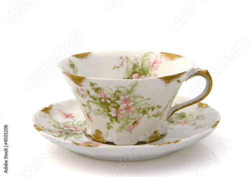 Antique Teacup and Saucer on White