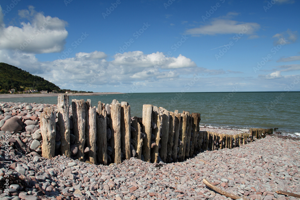 Wooden Sea Defence Posts on a Shingle Beach