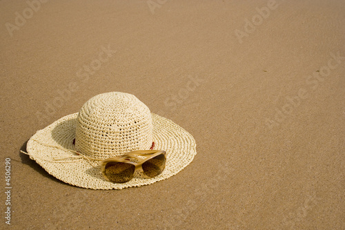 sunglass and summer hat photo
