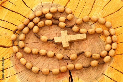 Wooden rosary on wood