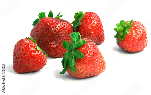 Strawberries over white background.