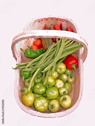 Wooden basket containing raw vegetables