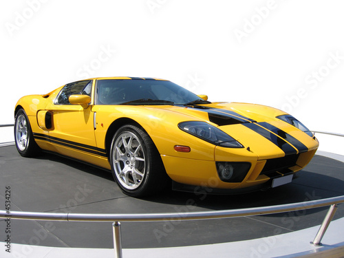 Yellow super car on an exhibition stand